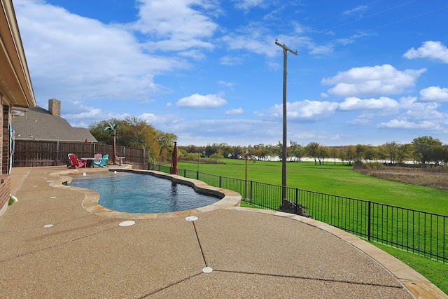 view of pool with a yard and a patio