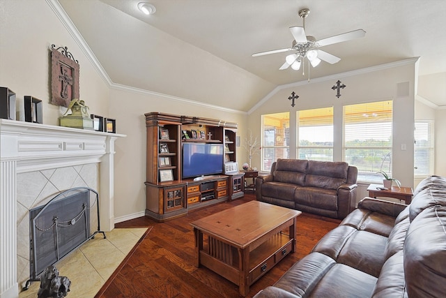 living room with lofted ceiling, crown molding, ceiling fan, a fireplace, and light hardwood / wood-style floors