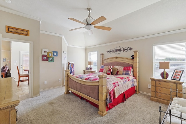 carpeted bedroom featuring multiple windows, ceiling fan, crown molding, and lofted ceiling