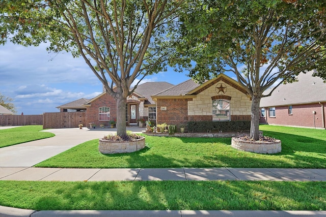 ranch-style house featuring a front lawn