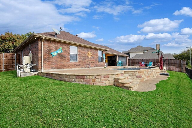 rear view of house featuring a patio, a fenced in pool, and a lawn