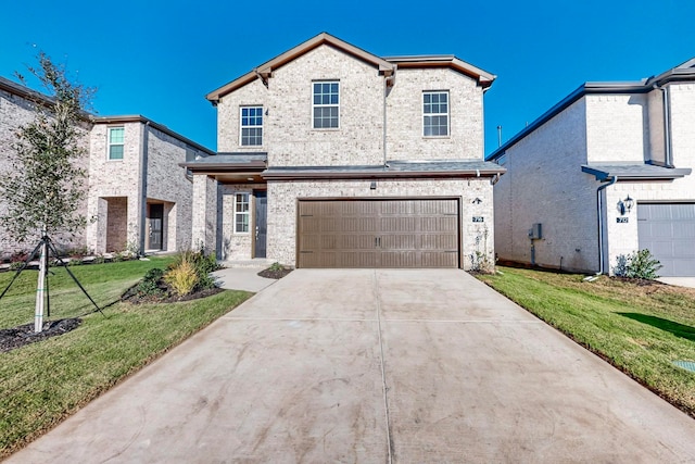 view of front facade featuring a front yard and a garage