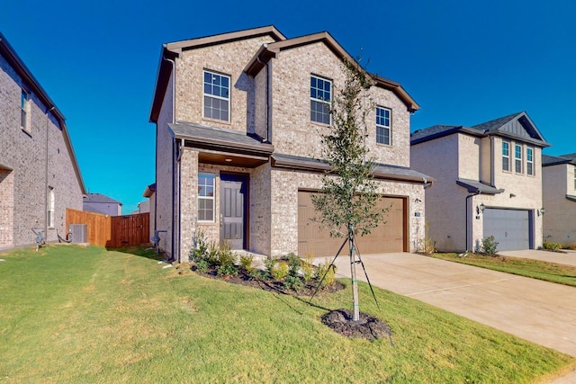 view of front of home with a garage and a front lawn