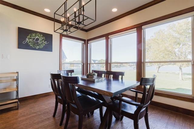 dining room featuring crown molding, baseboards, dark wood-style floors, a chandelier, and recessed lighting