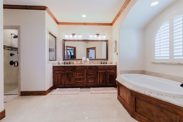 bathroom featuring crown molding, a sink, double vanity, a shower stall, and a bath