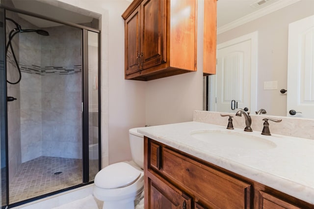 full bathroom featuring ornamental molding, a stall shower, vanity, and toilet