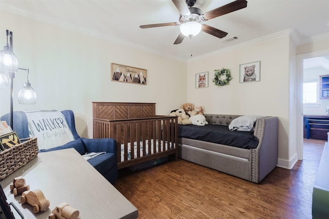 bedroom with ceiling fan, ornamental molding, wood finished floors, and visible vents