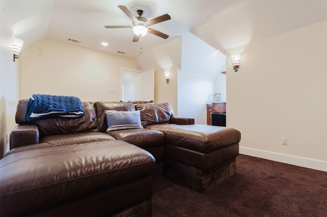 carpeted cinema with ceiling fan, visible vents, baseboards, and lofted ceiling