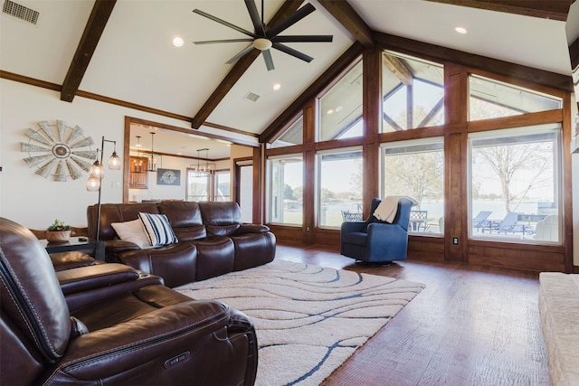 living area with beam ceiling, wood finished floors, visible vents, and a notable chandelier