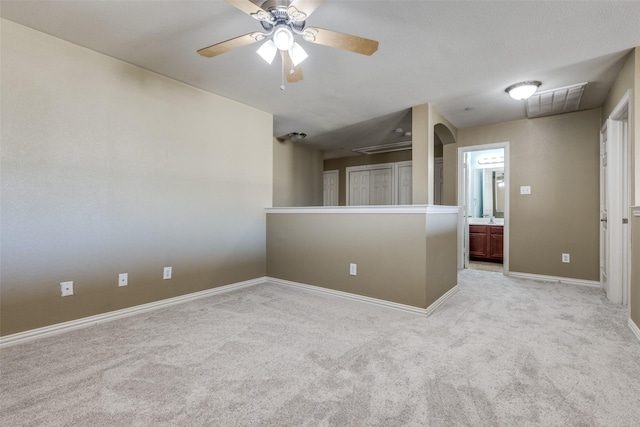 carpeted empty room with ceiling fan