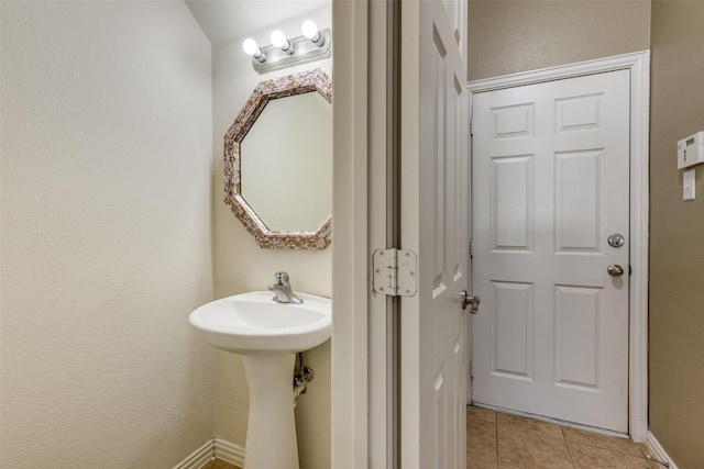 bathroom with tile patterned floors