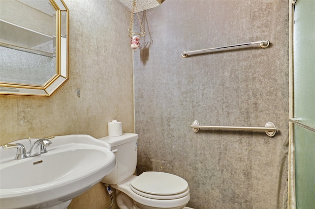 bathroom featuring toilet and sink