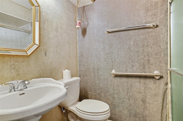 12502 Burninglog Ln, Dallas, TX 75243 - bathroom featuring a sink and toilet