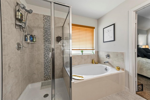 full bathroom featuring a garden tub, a shower stall, ensuite bathroom, and tile patterned flooring