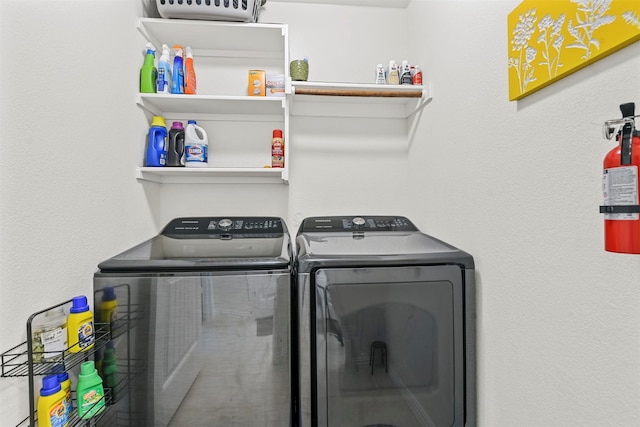 laundry area featuring washing machine and clothes dryer