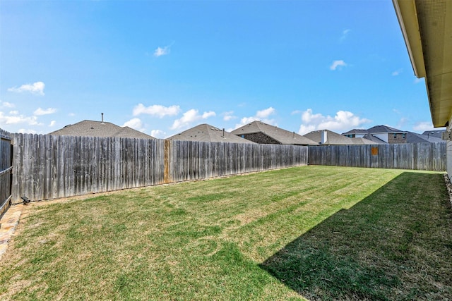 view of yard with a fenced backyard