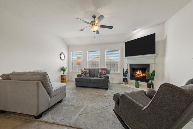 living room with ceiling fan and lofted ceiling