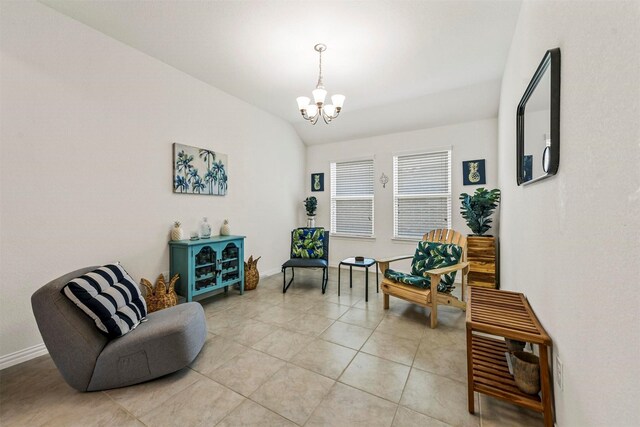 living room with light tile patterned floors and a chandelier