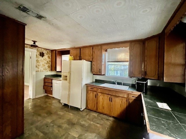 kitchen with sink and white appliances