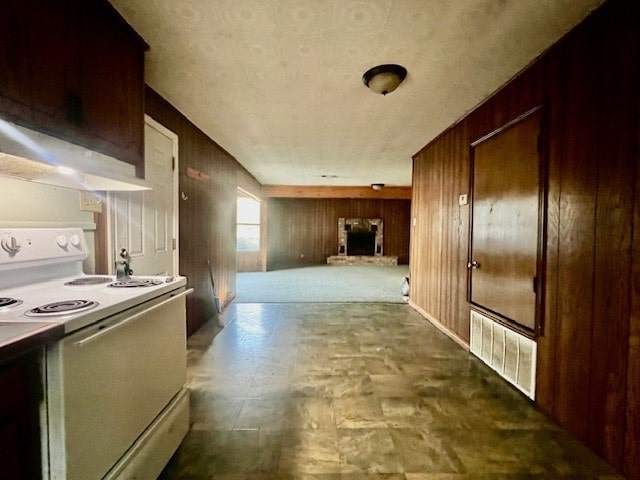 hallway featuring wooden walls