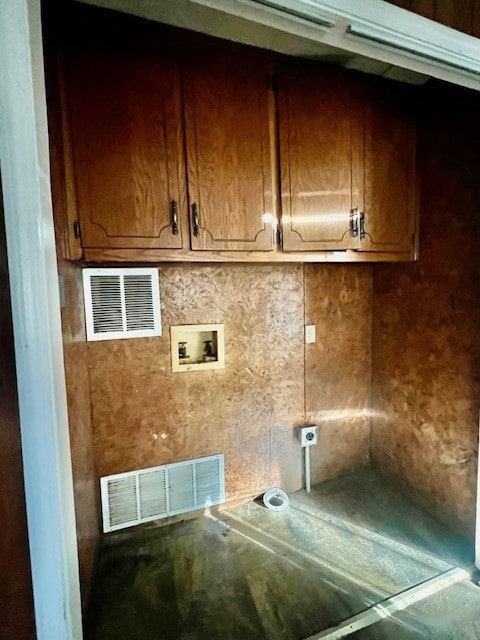 washroom with cabinets and hookup for a washing machine