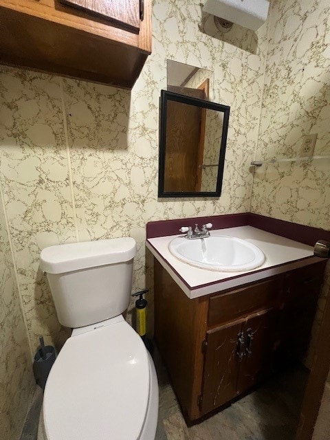 bathroom with vanity and toilet