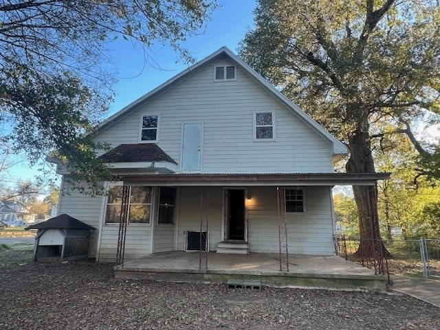 back of property featuring a patio