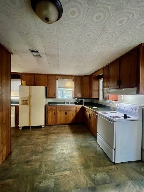 kitchen featuring sink and white appliances