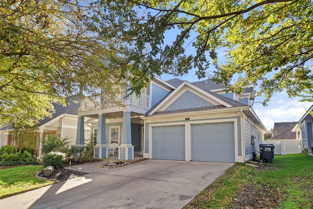 craftsman-style house featuring a balcony and a front yard