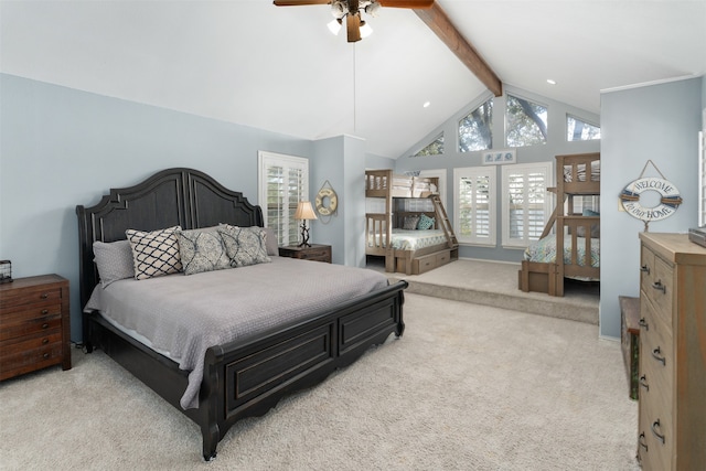 carpeted bedroom featuring multiple windows, ceiling fan, and lofted ceiling with beams