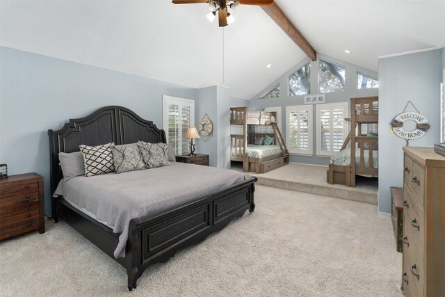 bedroom featuring lofted ceiling with beams, a ceiling fan, and light colored carpet