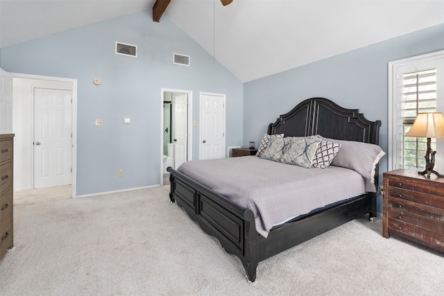 carpeted bedroom featuring connected bathroom, beam ceiling, high vaulted ceiling, and ceiling fan