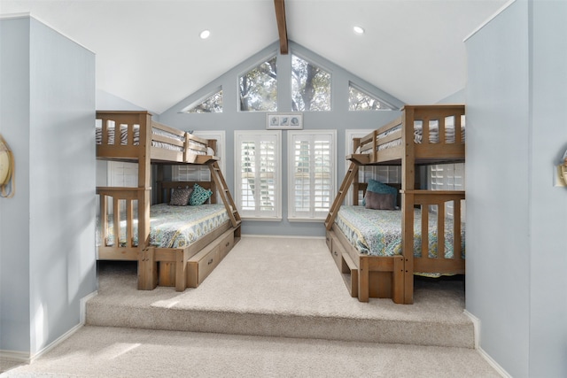 bedroom with carpet flooring and vaulted ceiling with beams