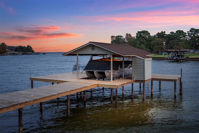 view of dock featuring a water view and boat lift