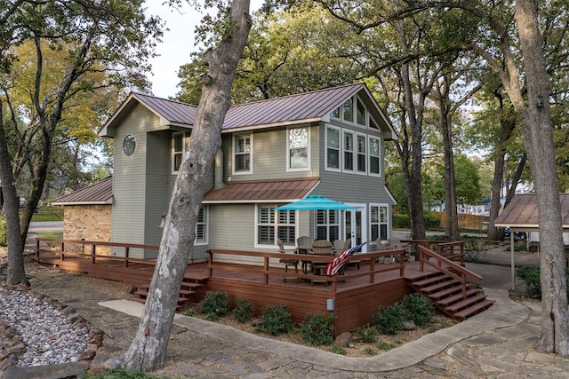 back of house with a wooden deck