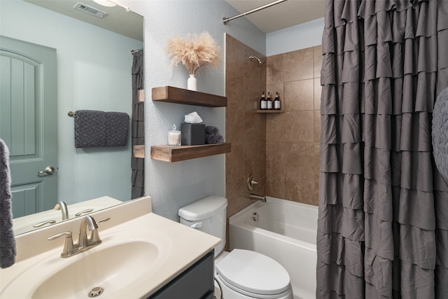 full bathroom with shower / bath combo, vanity, a textured ceiling, and toilet