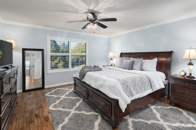 bedroom featuring ceiling fan, dark hardwood / wood-style flooring, and crown molding