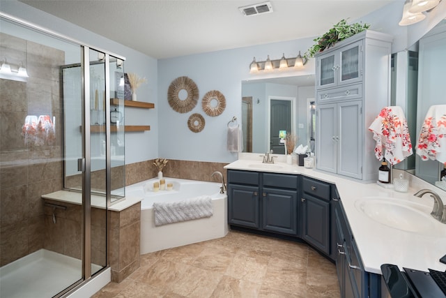 bathroom with vanity, plus walk in shower, and a textured ceiling