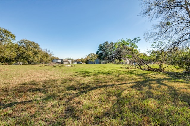 view of yard with a rural view