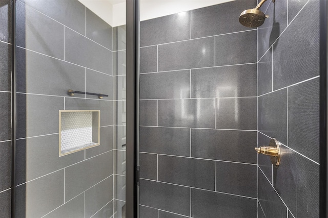 bathroom with tiled shower