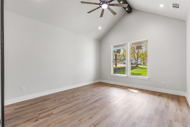 spare room featuring beam ceiling, high vaulted ceiling, light hardwood / wood-style flooring, and ceiling fan