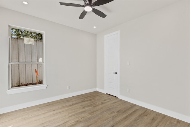 spare room featuring ceiling fan and wood-type flooring