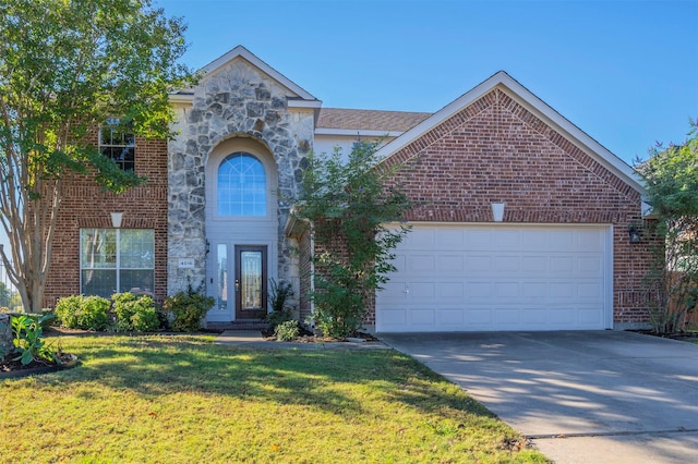 view of front of home featuring a garage and a front lawn