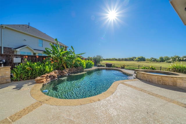 view of pool featuring an in ground hot tub and a patio