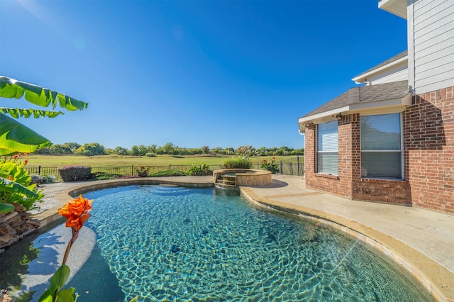 view of swimming pool with an in ground hot tub and a patio