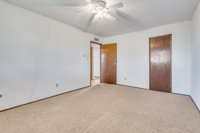 unfurnished bedroom featuring ceiling fan and light colored carpet