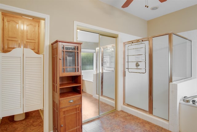 bathroom with separate shower and tub and ceiling fan