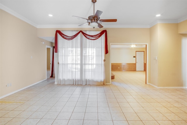 tiled empty room with ceiling fan and crown molding