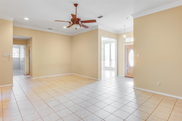 unfurnished room with light tile patterned floors, ceiling fan with notable chandelier, and ornamental molding