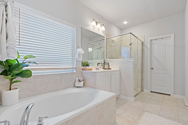 bathroom featuring tile patterned floors, vanity, and independent shower and bath